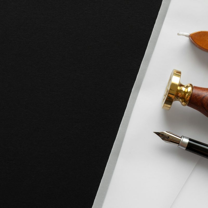Notary public wax stamper. White envelope with brown wax seal, golden stamp. Responsive design
